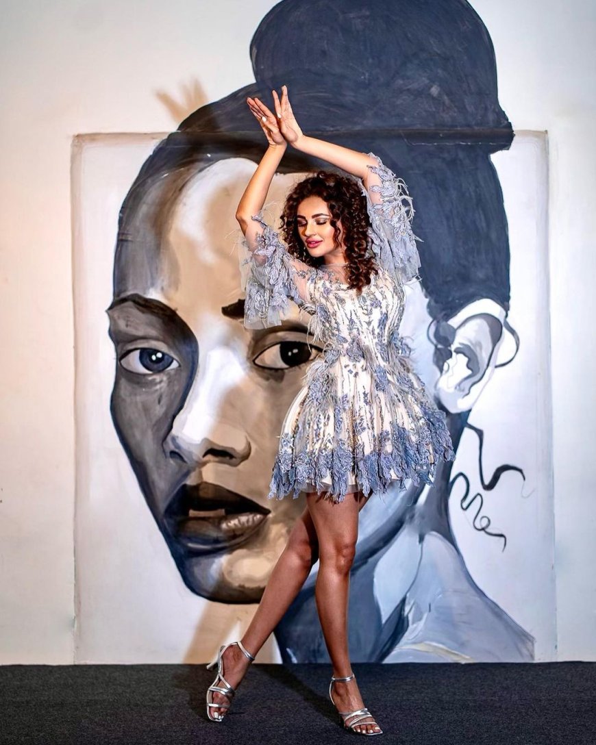 Seerat Kapoor Unleashes Creativity in Spontaneous Photoshoot With Unique Background In Sexy White Mini Embellished Dress